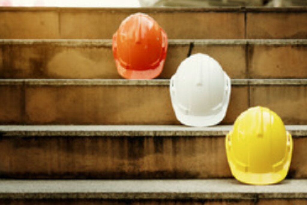 Multiple hard hats representing that we at Millgate Homes have several crews of professionals.